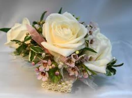 Cream Rose Wrist Corsage #7 - This beautiful cream spray rose wrist corsage can be made with a plain, rhinestone, or pearl wristlet. Boutonnieres and corsages can be made with any colour of accents and ribbon. Please call us for more information or specify colours of outfit/dress in the "Florists' Instructions" section of the check out page.