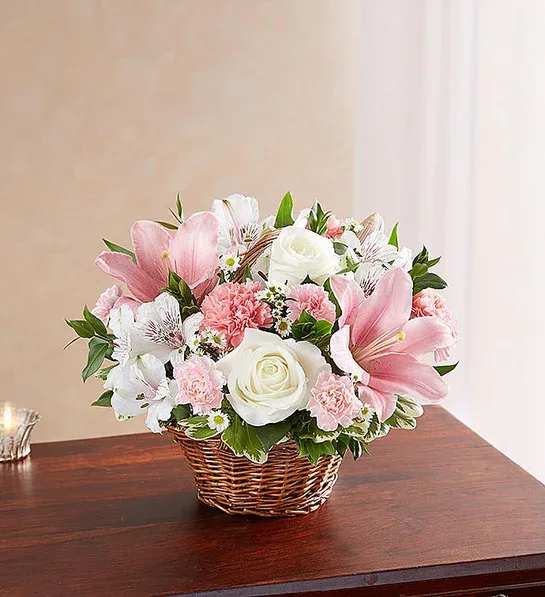 Peace, Prayers &amp; Blessings Pink &amp; White - Representing care, compassion and love - pink blooms can offer solace in times of sorrow. Artistically designed inside a keepsake willow basket, our arrangement in soothing pink hues is a touching way to offer your sincerest blessings.  Color of basket may vary - brown or white. 