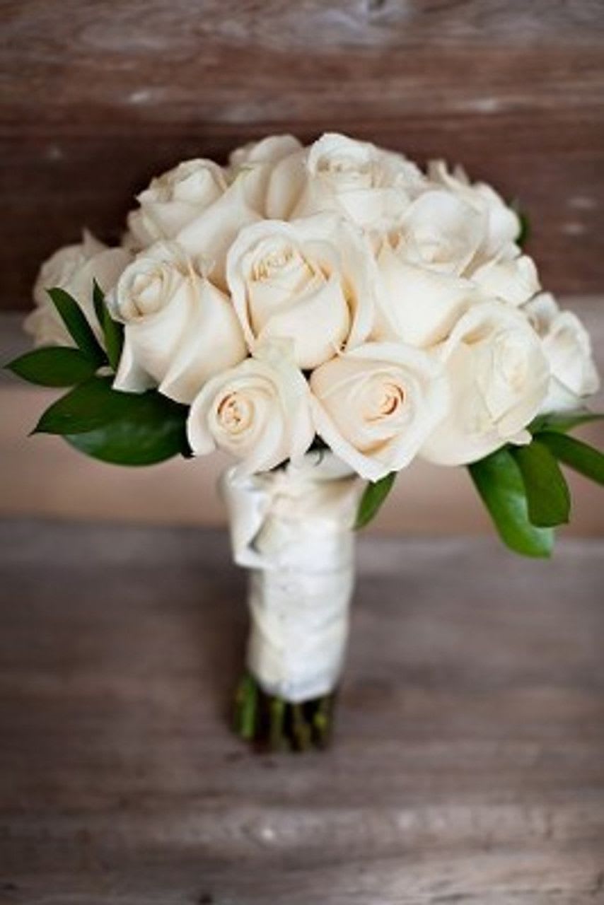 White Rose Bouquet  - A classic white rose bouquet hand tied with ribbon. The perfect accessory for any formal event including proms, weddings, and debutante balls.  