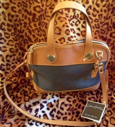 Tan handbag with a leopard-print background