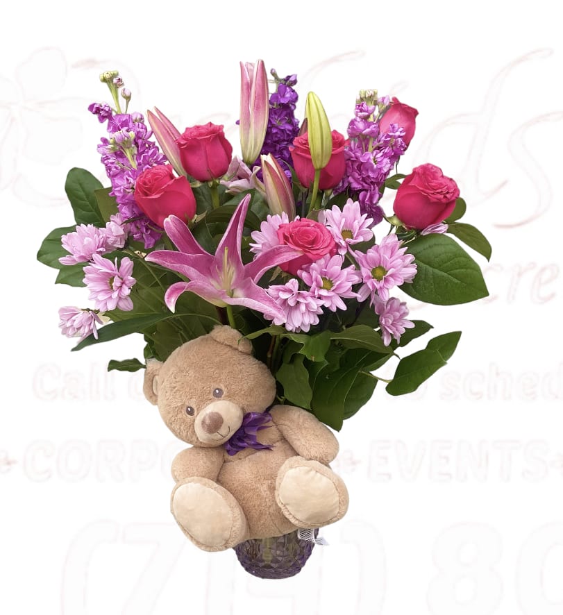 Pink and purple bouquet with a teddy bear attached