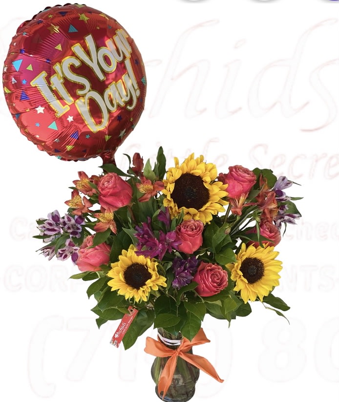 Bouquet of sunflowers, pink roses, and alstroemeria with a red "It's Your Day!" balloon