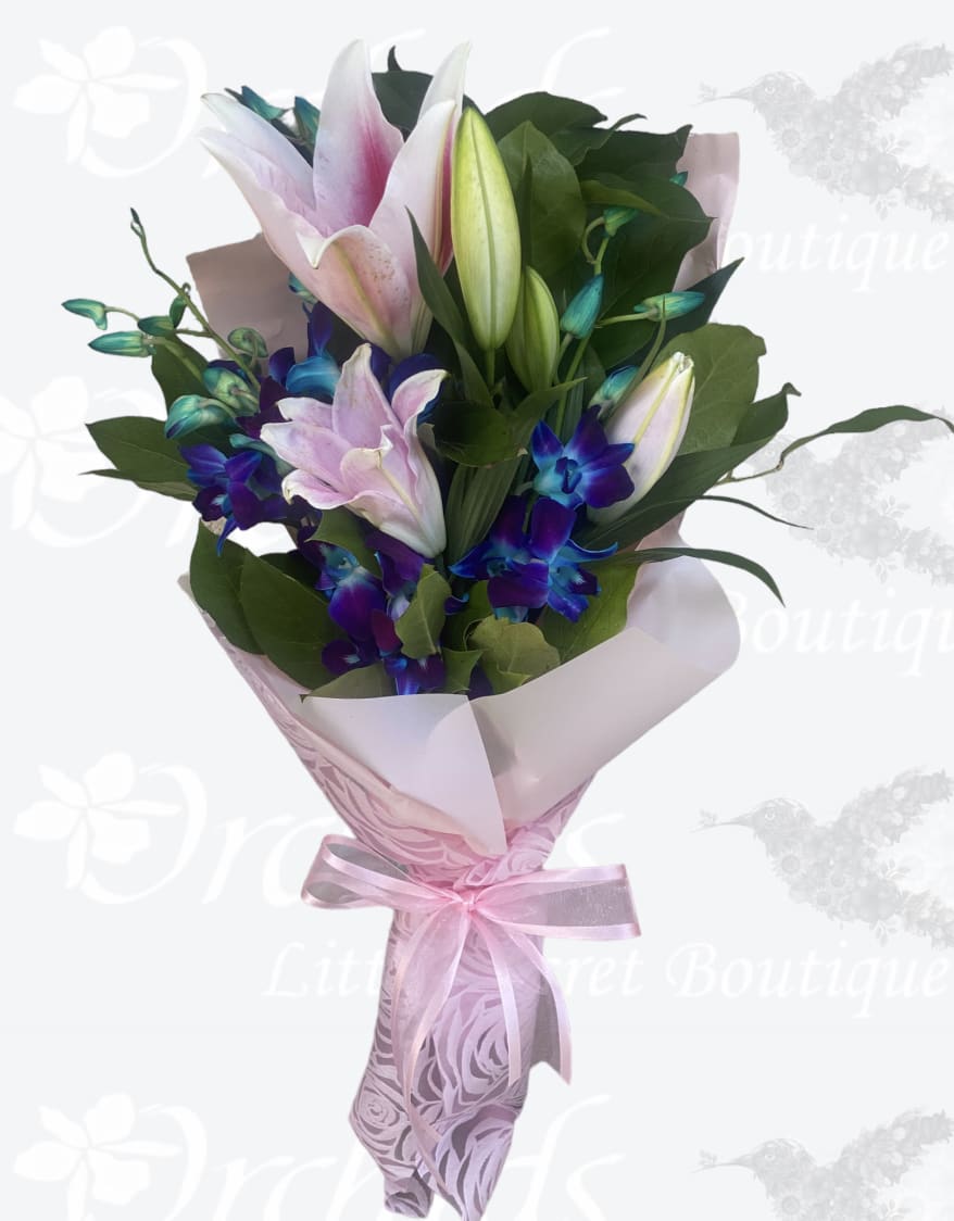 Pink and white lily bouquet with purple orchids wrapped in pink paper
