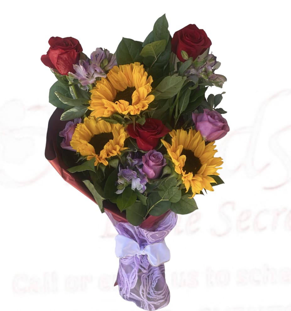 Bouquet of sunflowers, red roses, and purple flowers wrapped in lavender paper