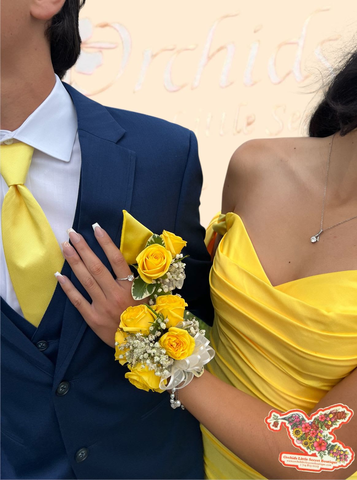 Yellow rose corsage and boutonniere on a couple in formal attire
