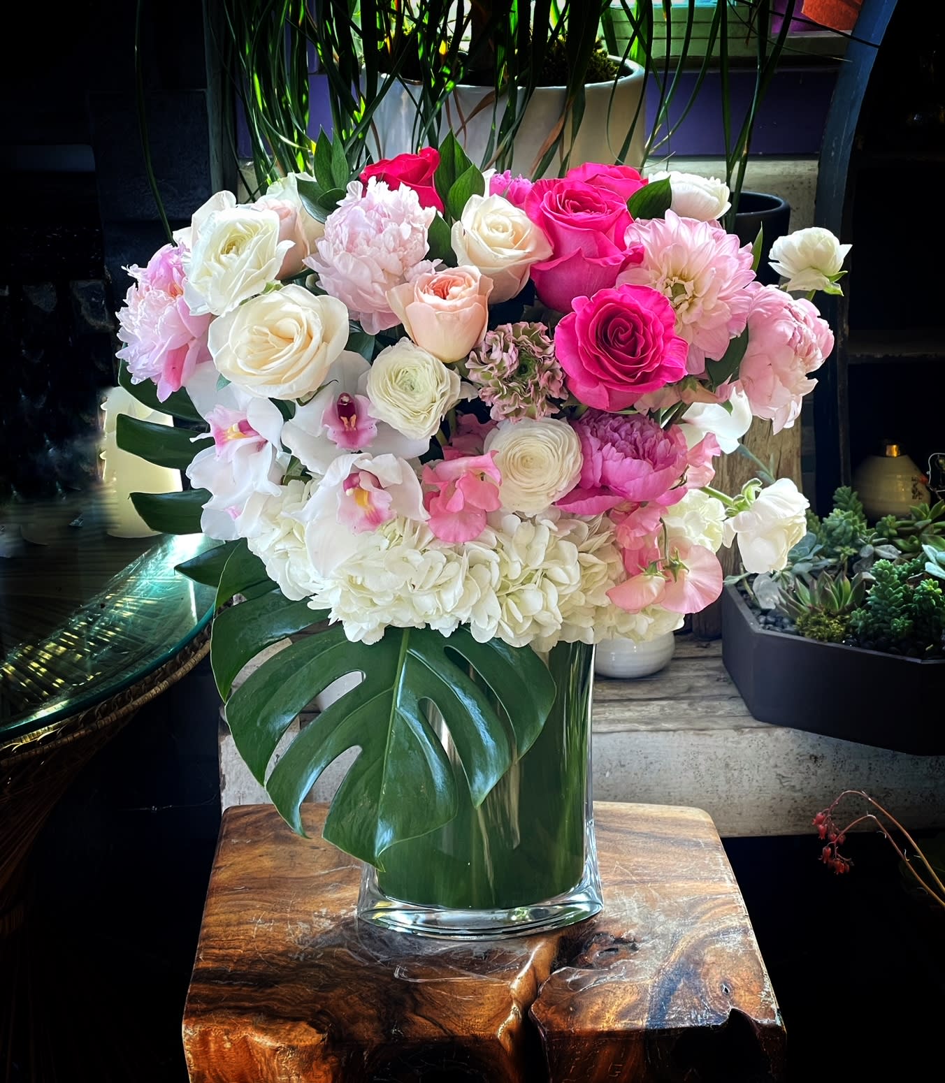Pink and white floral arrangement in a clear glass vase