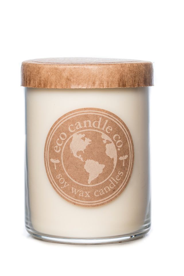 Soy wax candle in a glass jar with a wooden lid