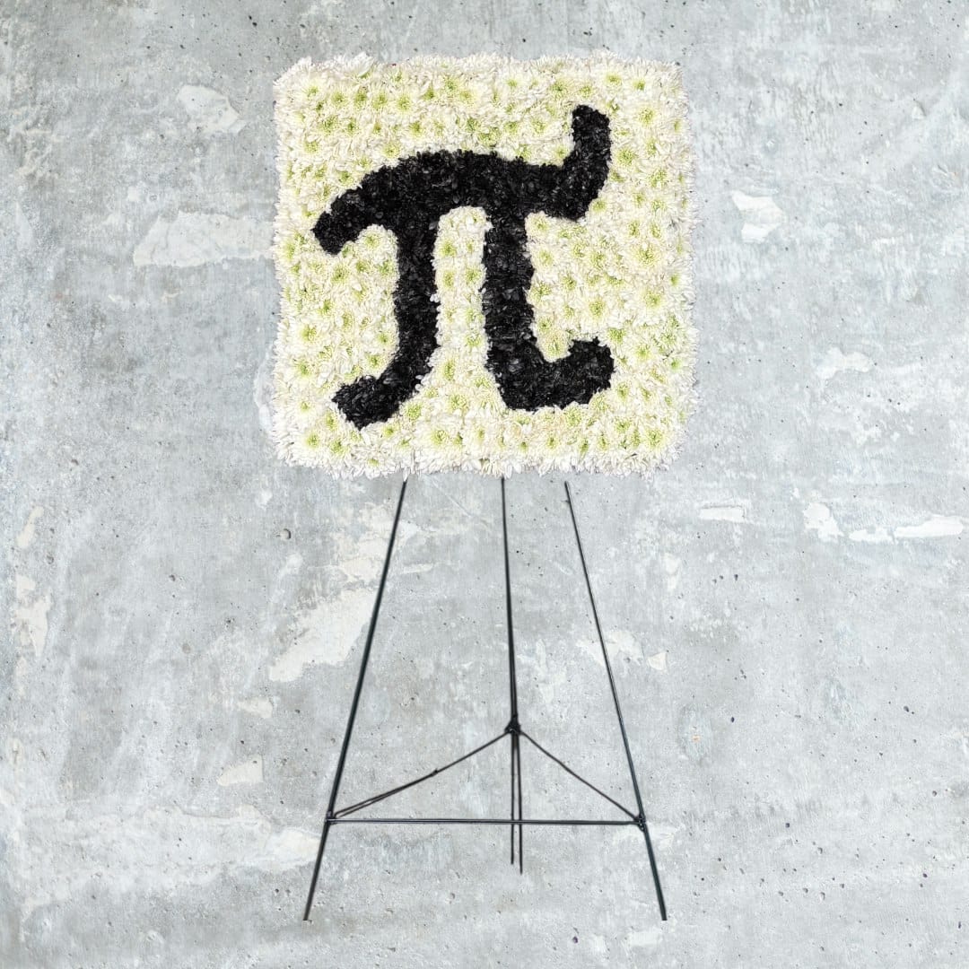 Square floral easel display with a black symbol on white flowers