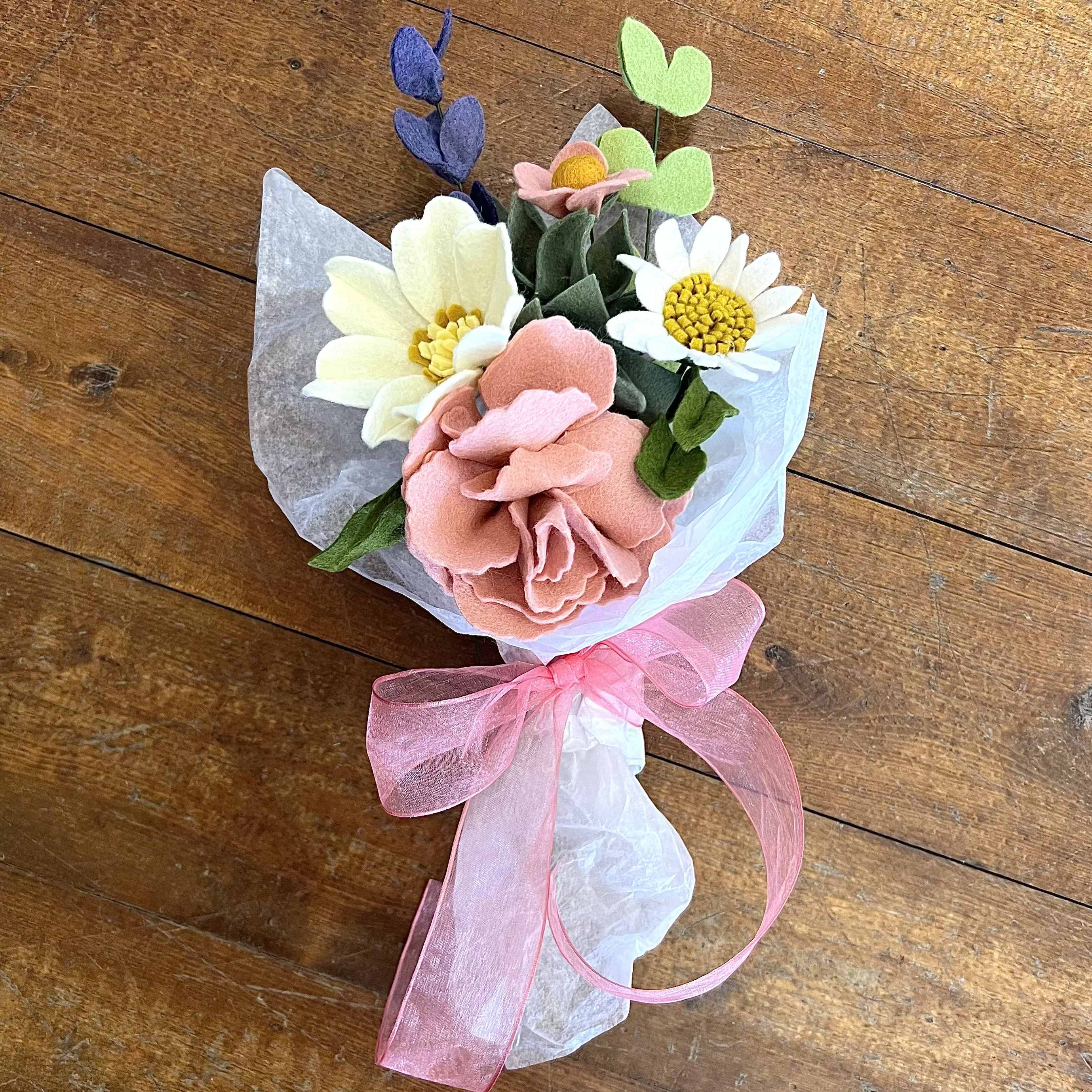 Forever Felt Flower Bouquet - Handcrafted felt flowers arranged in beautiful bouquet that will last for years to come.  Includes 7 assorted stems including flowers, greens and line flowers to create a balanced arrangement.