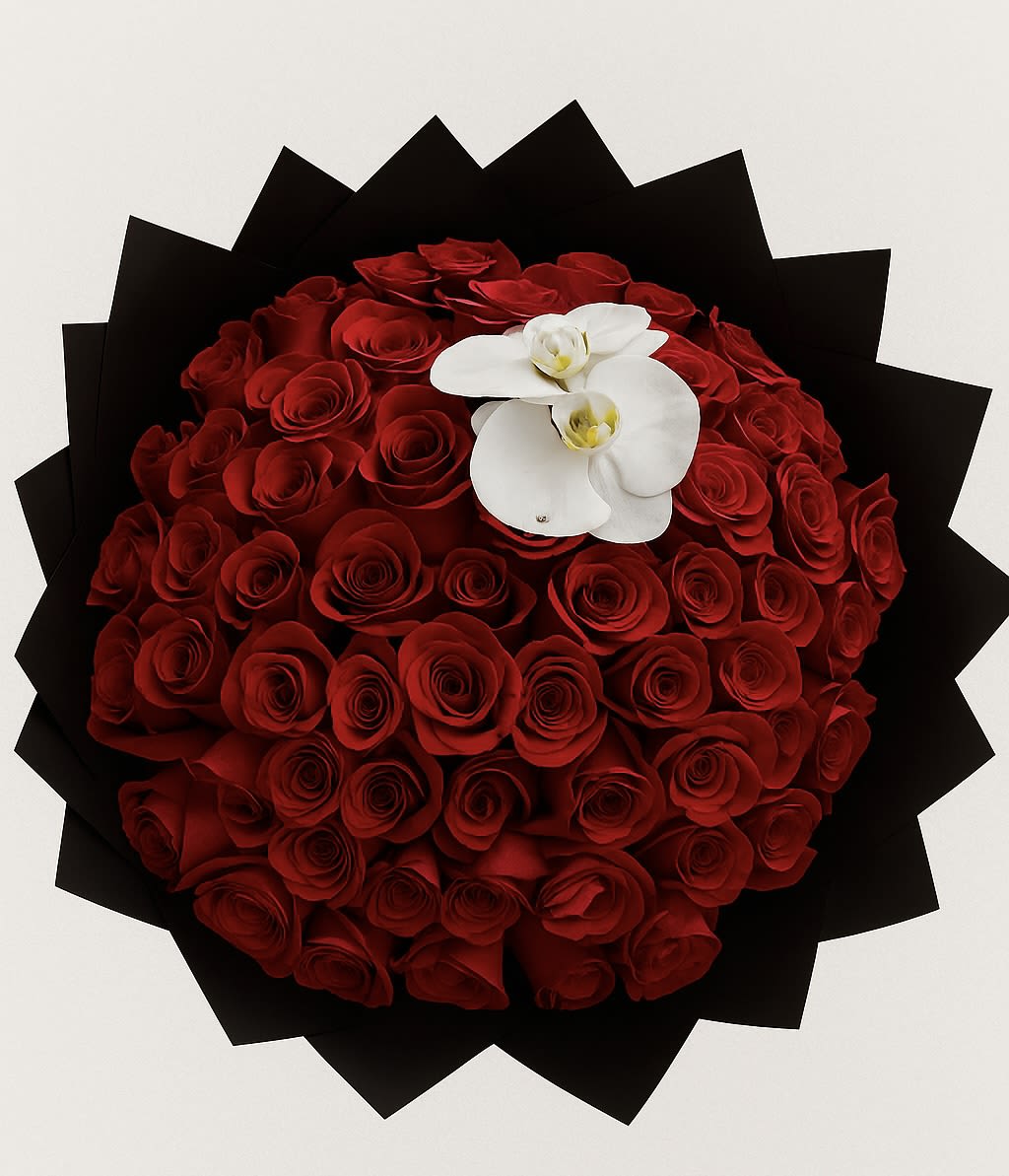 Round bouquet of red roses with white orchids on black wrap