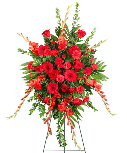 Large red floral standing spray on an easel