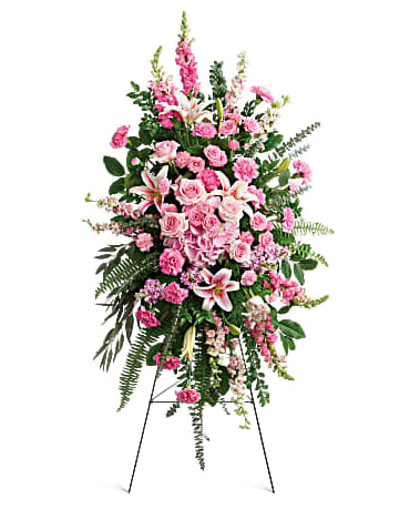 Tall pink floral standing spray on an easel
