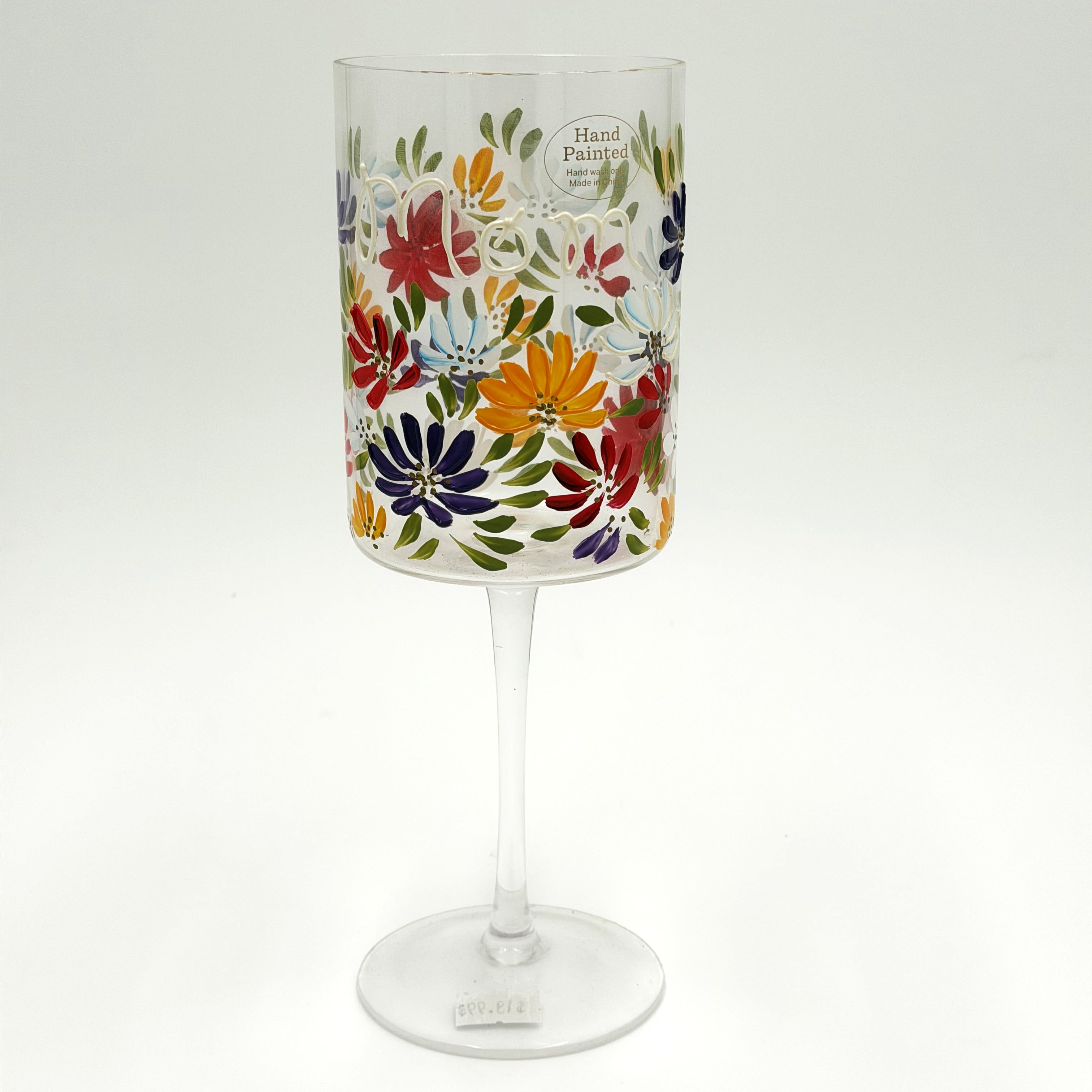 Mom Votive Holder - This beautifully hand-painted votive holder features a vibrant garden of colorful floral artwork that adds warmth and charm to any space. Delicate blooms in rich shades of red, yellow, blue, and pink wrap around the glass, creating a whimsical design that glows beautifully when illuminated by candlelight. Perfect for tabletops, special occasions, or everyday décor, this floral votive holder brings a cozy and elegant touch to any home.