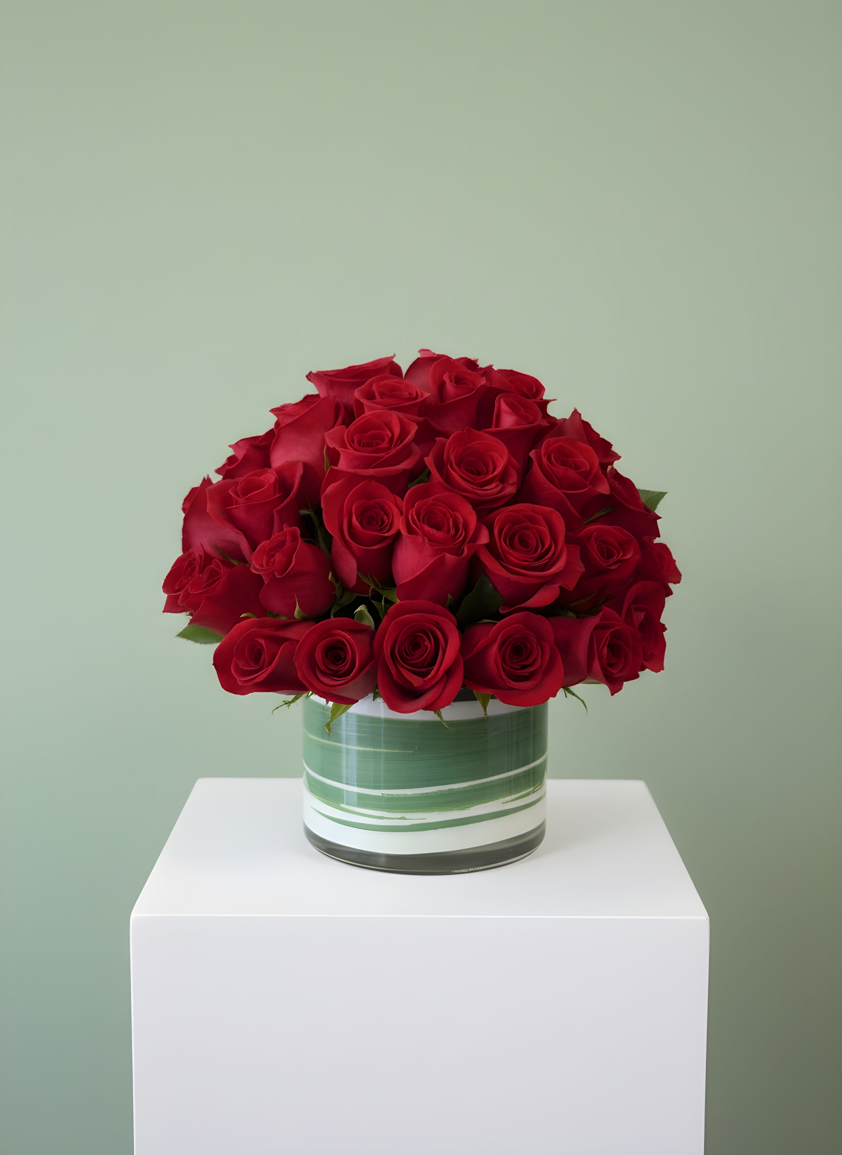 HALF OFF ROSE SPECIAL! 50 Red Roses - 50 Red Roses is the ultimate expression of love, featuring 50 premium long-stem red roses expertly designed in a modern 5 1/2" x 6 1/4" glass cylinder vase. Handcrafted by the designers at All Occasions Florist, this luxurious arrangement is perfect for anniversaries, Valentine's Day, birthdays, proposals, or any occasion when only the very best will do.  Our talented florists carefully select the freshest red roses to create a full, elegant design that makes a stunning statement. Whether you're celebrating a milestone, expressing your love, or sending a romantic surprise, this timeless bouquet is sure to leave a lasting impression.  We proudly offer same-day flower delivery in Dallas, Richardson, Plano, Garland, Addison, Mesquite, Irving, and surrounding DFW communities. Every arrangement is hand-designed using premium blooms to ensure exceptional beauty and freshness.  Vase Size: 5 1/2" x 6 1/4"
