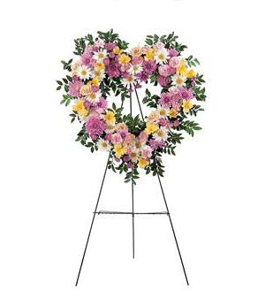 Heart-shaped floral wreath on a standing easel
