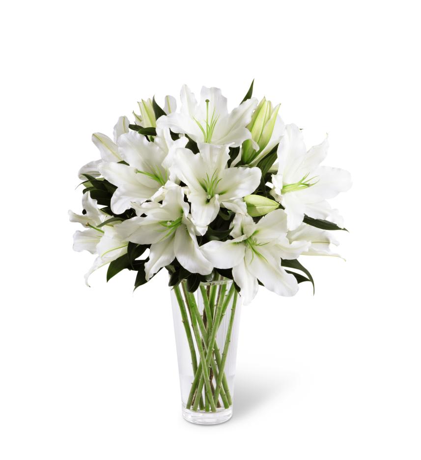 FTD Light In Your Honor Bouquet - The FTD Light In Your Honor Bouquet is a beautifully bright  arrangement bursting with elegant fragrance to convey your deepest  sympathies for the loss of their loved one. A stunning bouquet of  gorgeous Oriental lilies are accented with lush greens and seated in a  clear glass vase to create a bouquet that is serenely sophisticated,  offering comfort and peace in their time of need.  22âh x 15âw