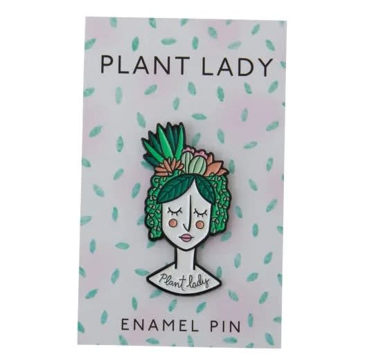 Plant lady enamel pin on a patterned backing card