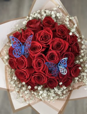 Bouquet of red roses with white baby's breath and blue butterfly picks