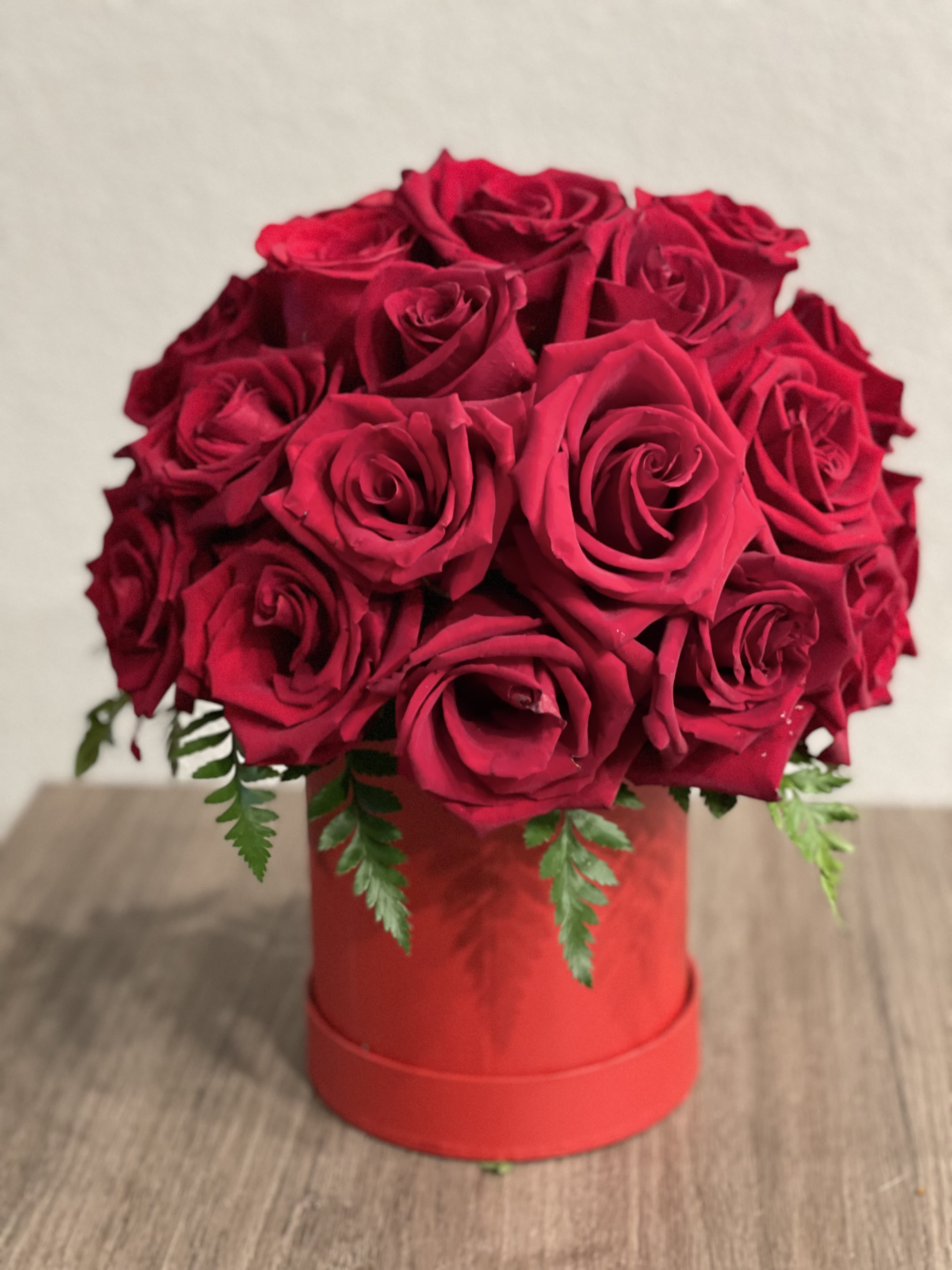 Red rose bouquet in a red hat box
