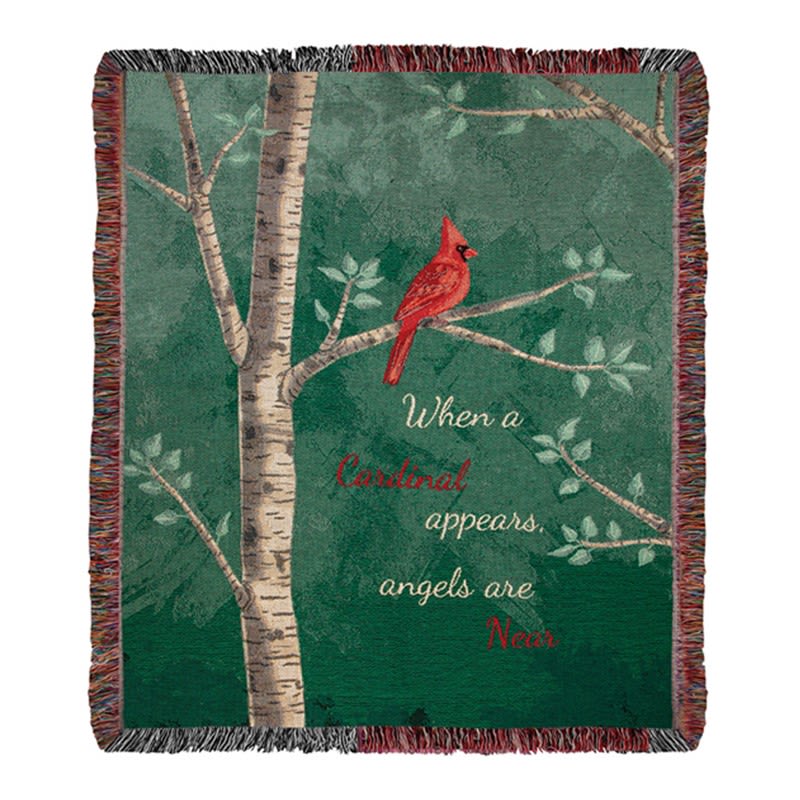 Woven throw blanket with red cardinal on tree branches and the phrase 'When a cardinal appears, angels are near'.