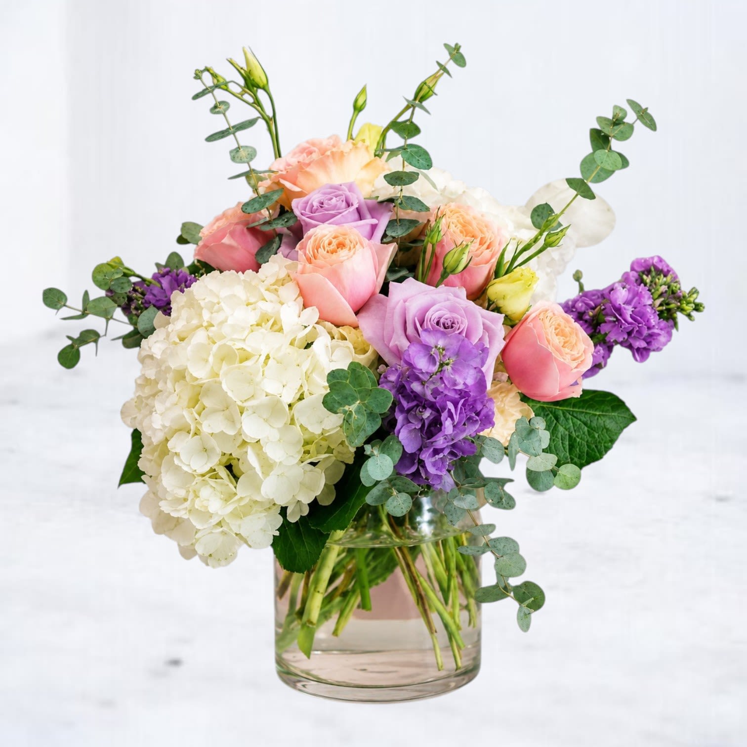 Honeydew - Honeydew is a fresh and airy floral arrangement featuring white hydrangea, lavender roses, blush garden roses, stock, eucalyptus, and seasonal blooms in soft pastel tones. Designed with a romantic garden-inspired style, this arrangement makes a beautiful gift for birthdays, anniversaries, sympathy sentiments, thank you gestures, or simply brightening someone's day. Hand-designed and delivered with care by Whiskey Wallflower, Honeydew brings a touch of elegance and sweetness to any occasion throughout Houston, Montgomery, Magnolia, The Woodlands, Conroe, and surrounding areas.