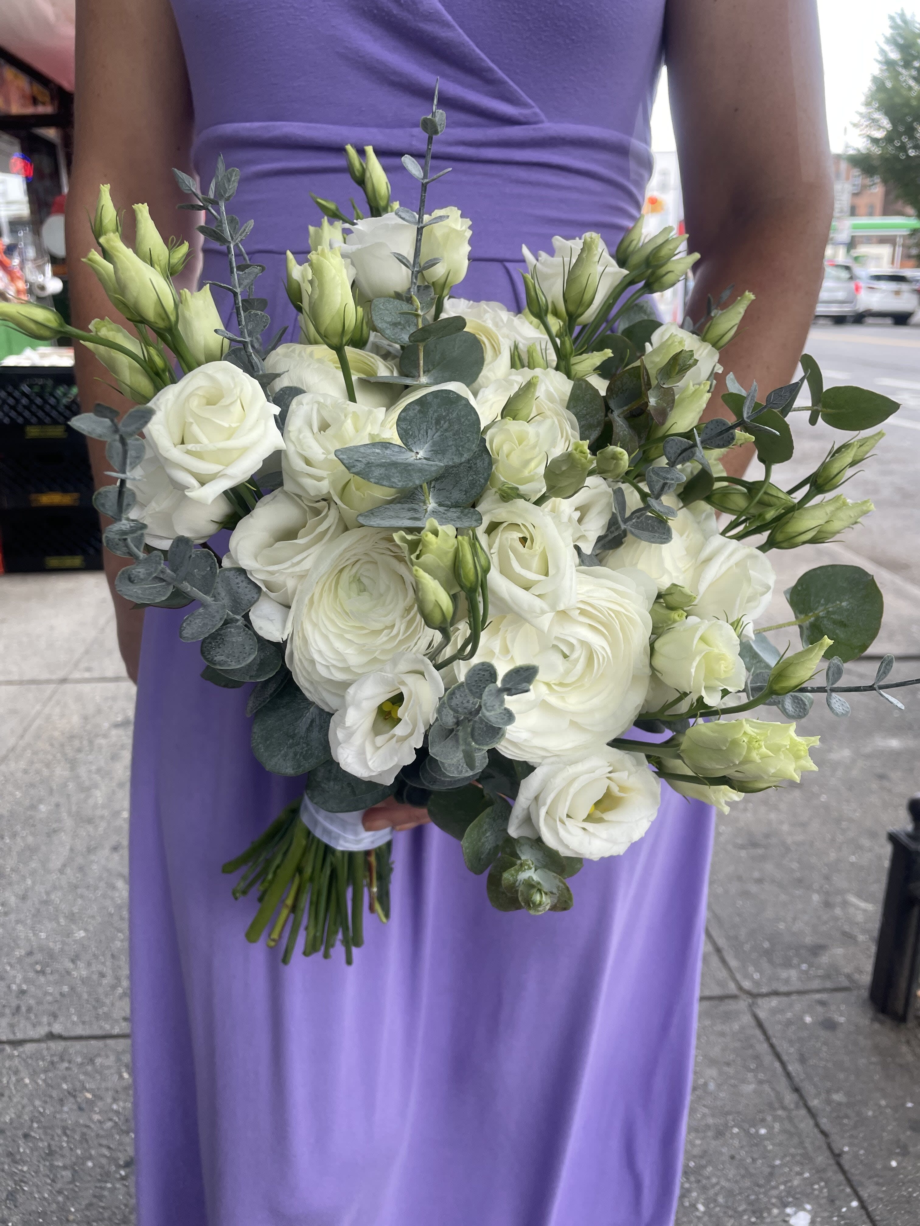 White bouquet of roses and lisianthus with eucalyptus