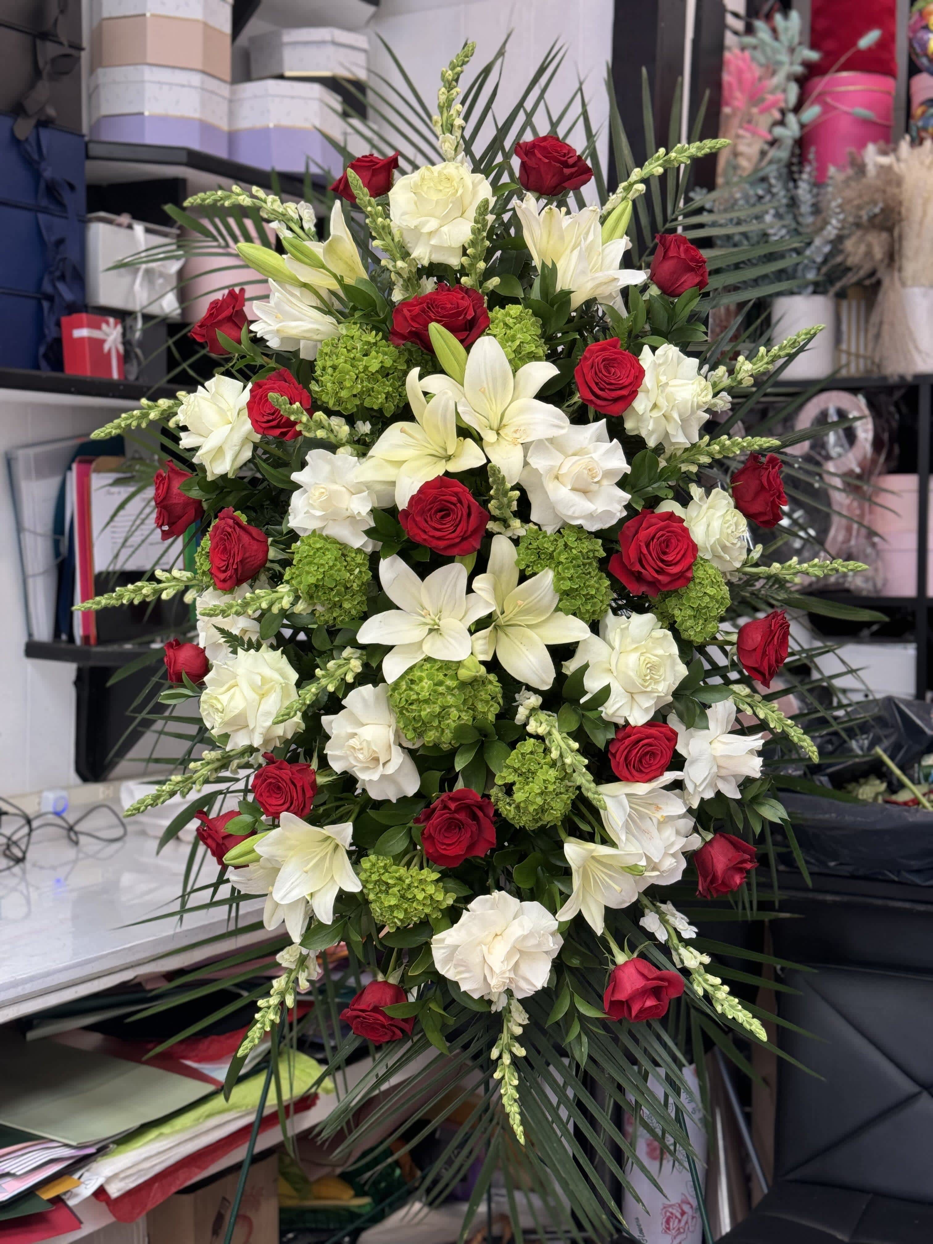 Large red and white floral spray with lilies and roses