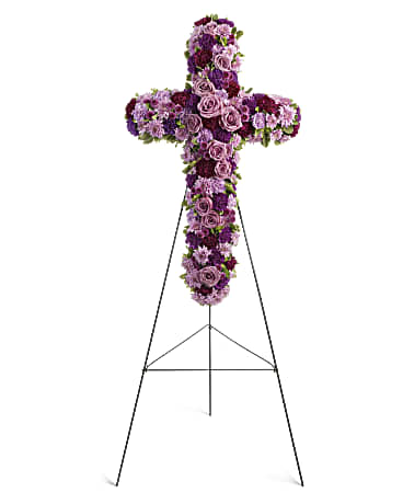 Purple floral cross on a metal stand