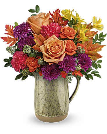 Harvest Joy Bouquet - Celebrate the essence of fall with this abundant bouquet of autumnal roses, artfully arranged in a rustic glazed ceramic pitcher.