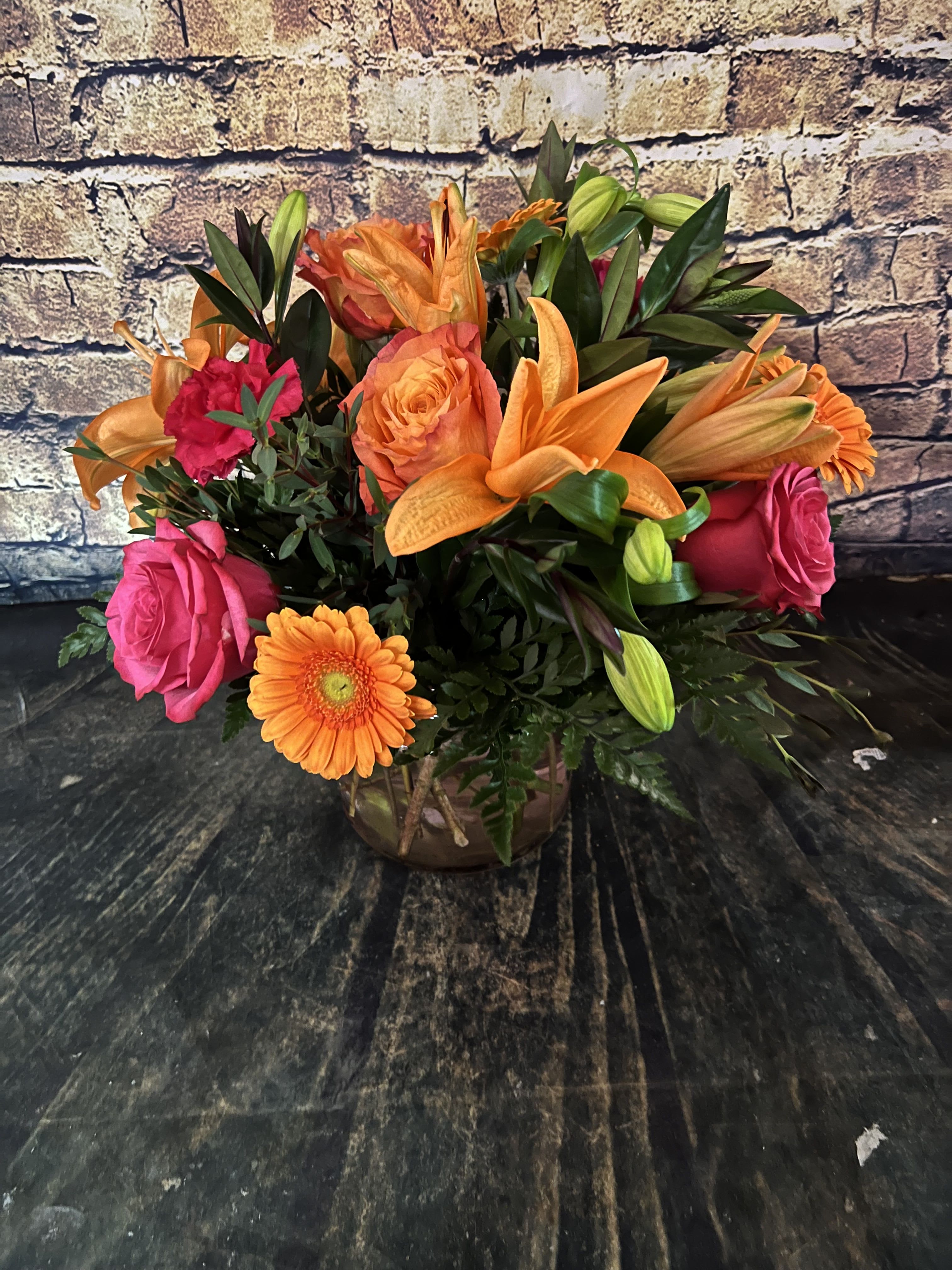 Bowl Of Beauty - Stunning roses, Gerbera daisies, lilies and carnations make a dazzling impression!