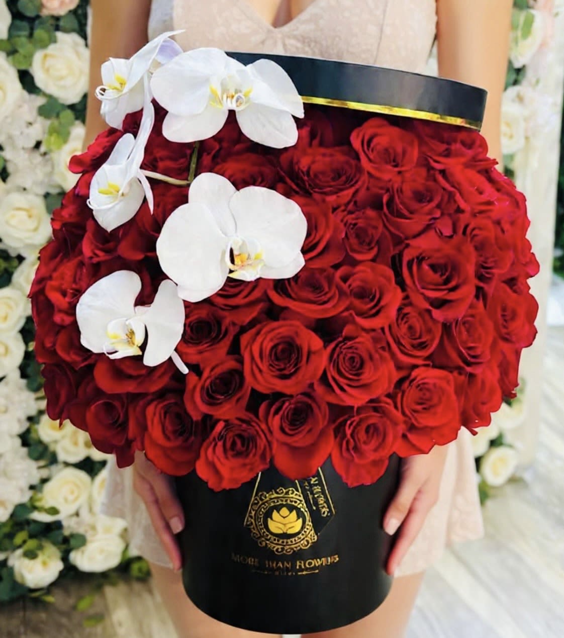 75 Roses Hat Box - Red - 75 Roses in a our signature boxes accented with phalaenopsis orchids