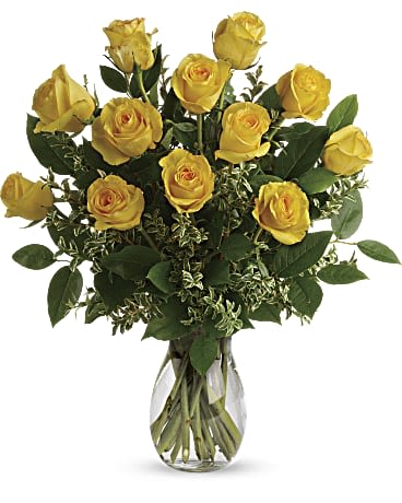 Yellow roses arranged in a clear glass vase