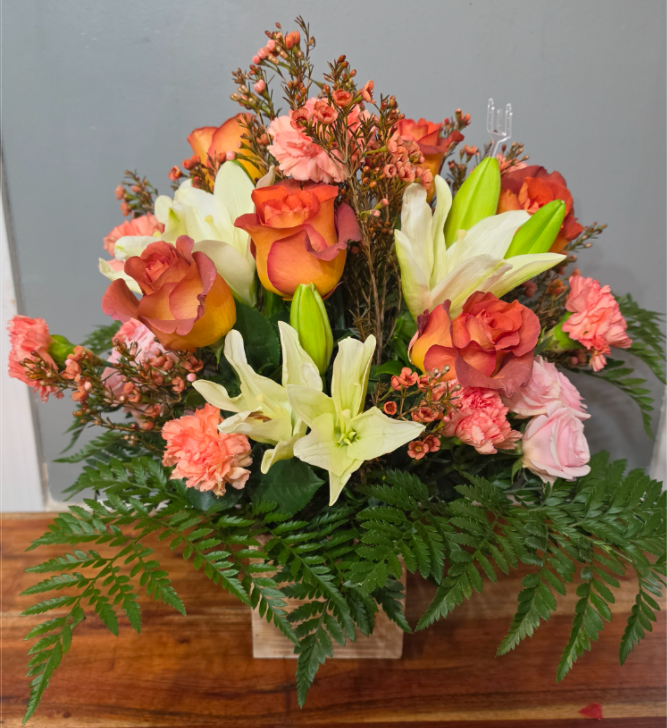 Orange Burst - Gorgeous sunburst orange roses and whit lillies