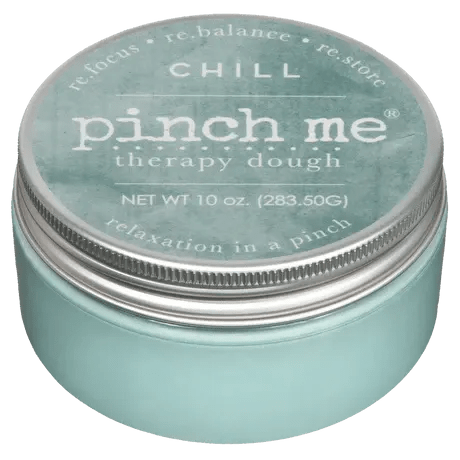 A teal tin labeled "pinch me therapy dough"