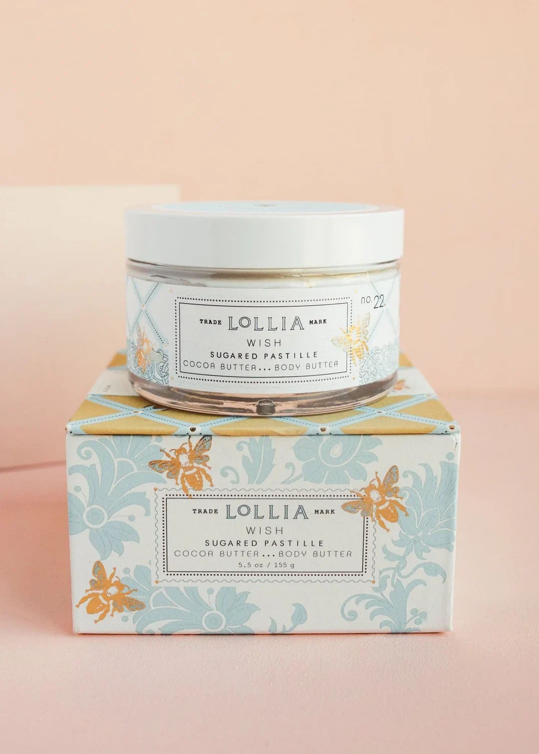 Jar of body butter on a decorative box