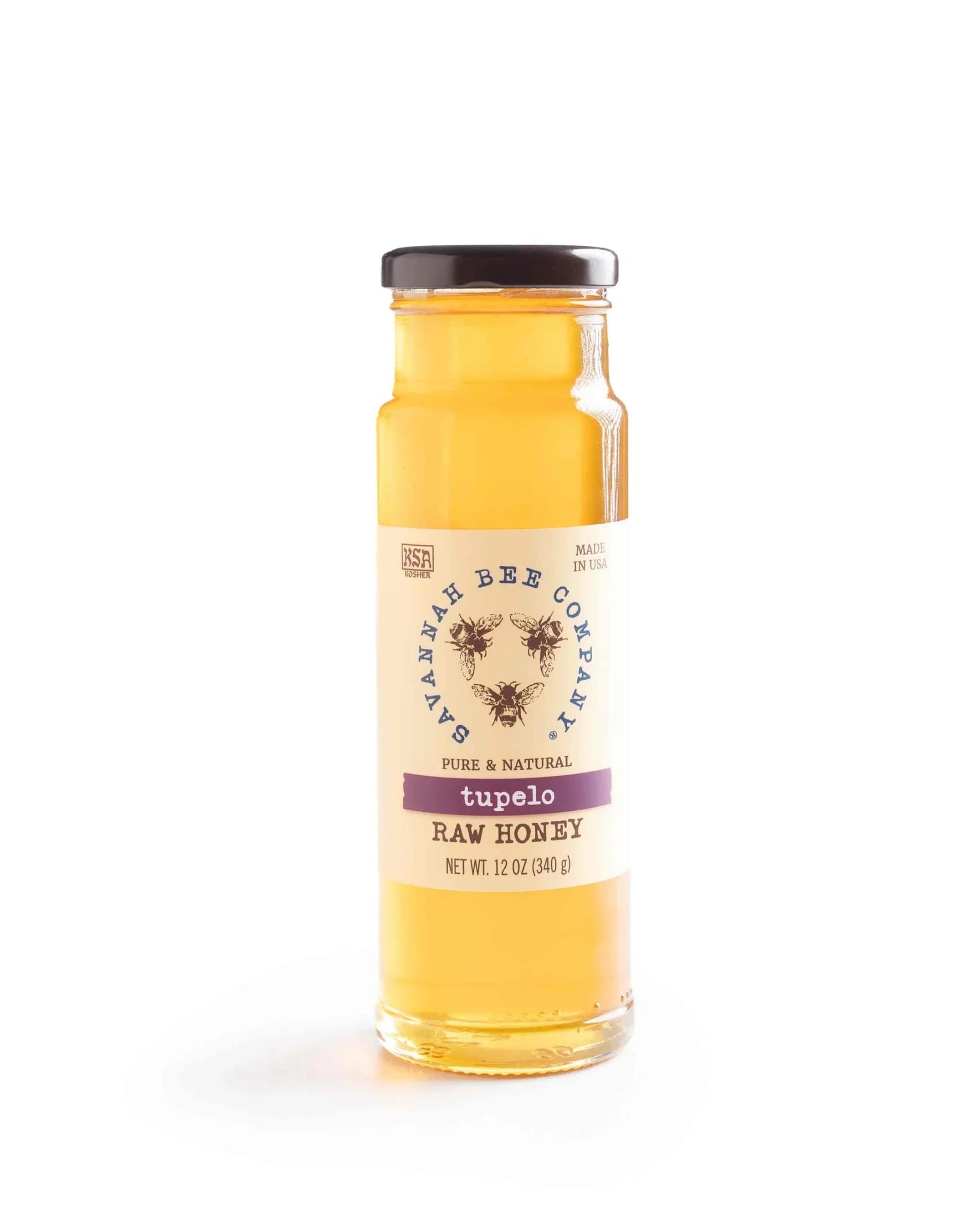 Jar of tupelo raw honey with a dark lid