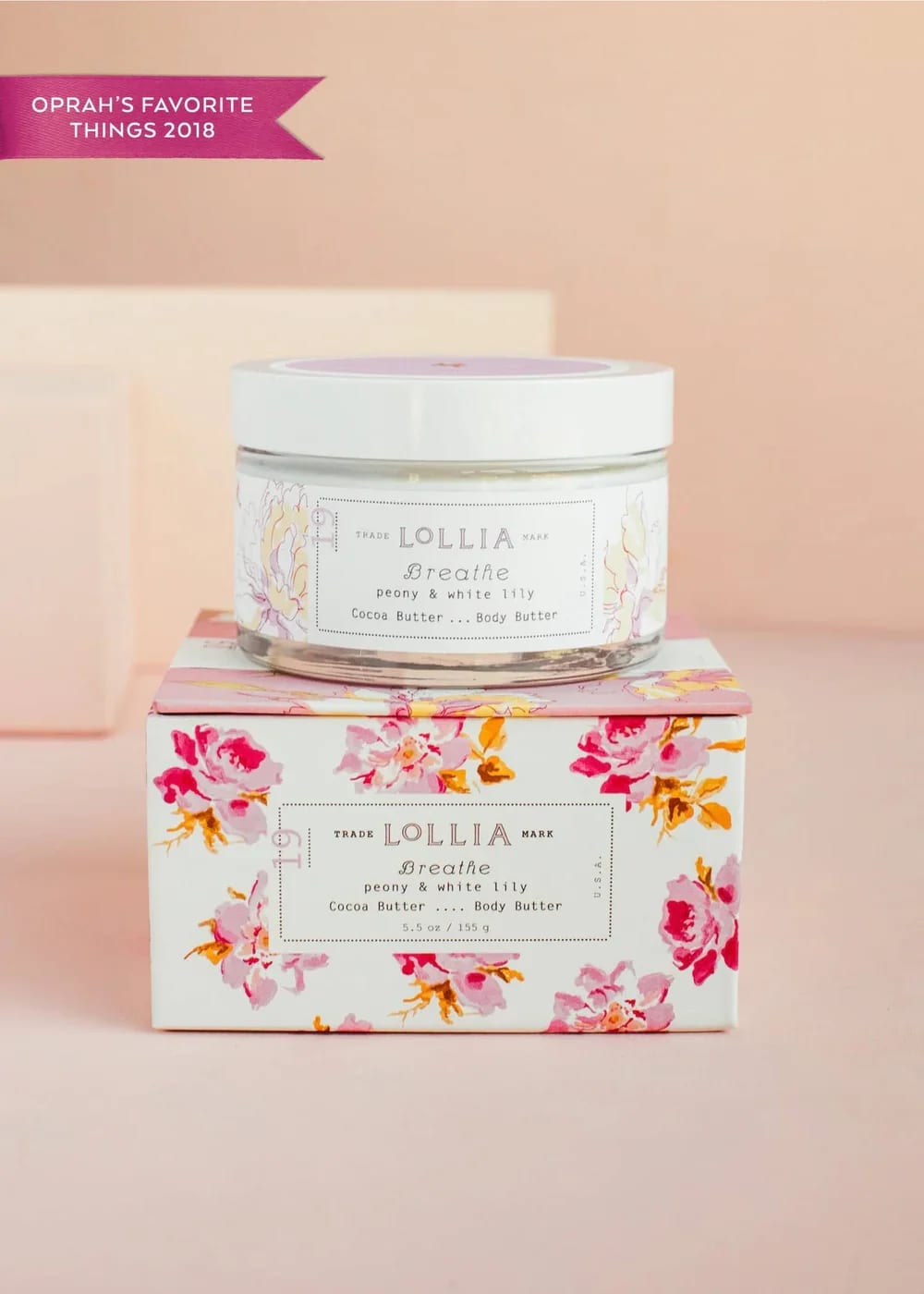 Jar of body butter on a floral-patterned box