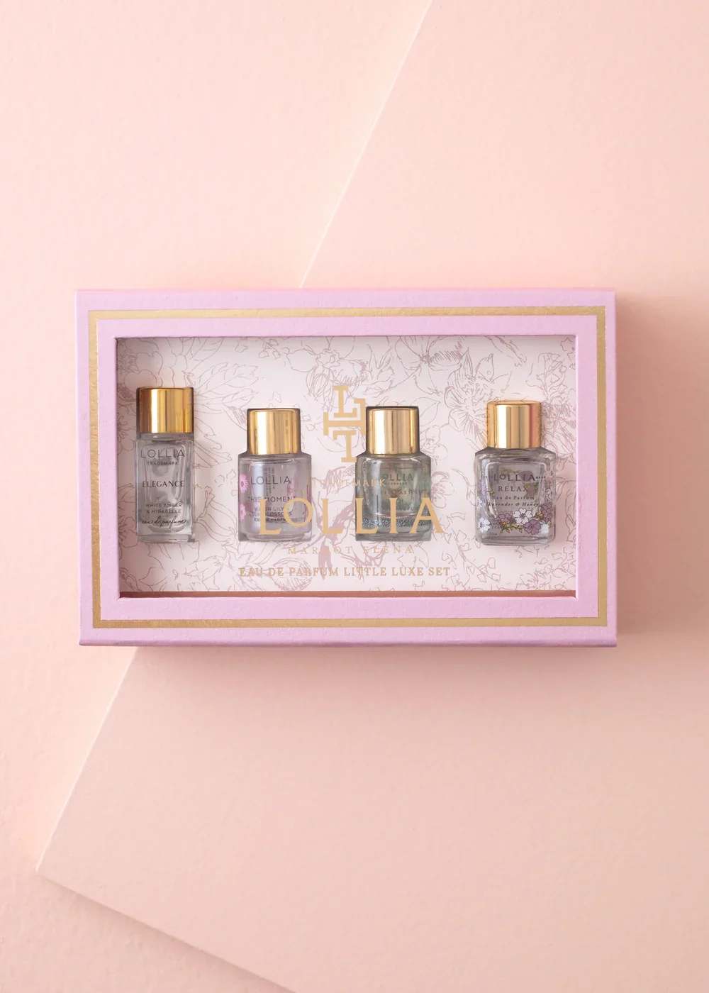 Pink gift box with four small perfume bottles inside