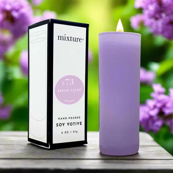 Lavender soy votive candle beside its box