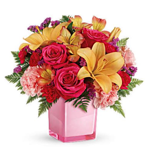 Pop of Fun - Pop go the petals! This festive, fun-loving mix of flowers is a cheerful gift for any occasion. Hand-delivered in our exclusive Color Splash cube, these pink roses and bright peach lilies are guaranteed to please! This fresh, fun mix of pink roses, peach asiatic lilies, peach alstroemeria, pink carnations and pink miniature carnations is accented with raspberry sinuata statice and leatherleaf fern. Delivered in Teleflora's Color Splash cube. Orientation: All-Around