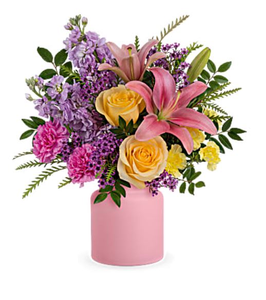 Cheerful Gift Bouquet - Cheers to you! Celebrate any day with this cheerful gift of pink lilies and yellow roses, delivered in a fun frosted glass jar. Pink asiatic lilies, light yellow roses, hot pink carnations, miniature yellow carnations, lavender stock and lavender waxflower are accented with huckleberry and grevillea. Delivered in Teleflora's Savannah Jar.