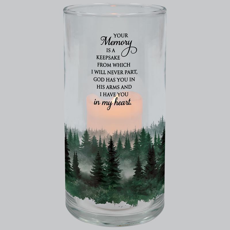 Glass cylinder candle holder with forest design, memorial quote, and lit candle inside