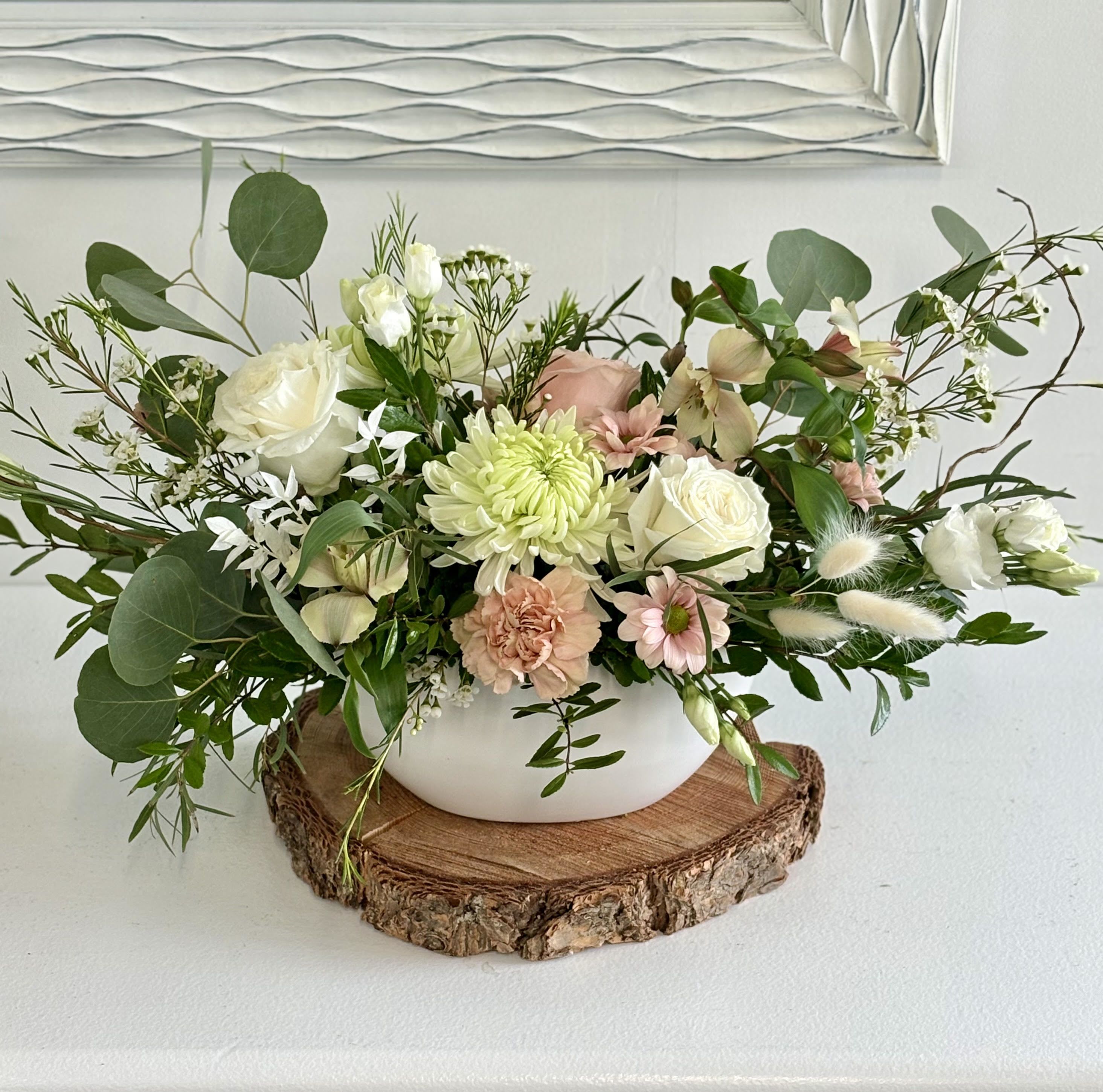 Ivory Meadow - Ivory Meadow is a soft, elegant arrangement in creamy whites, blush tones, and fresh greenery. It has a natural, airy feel with a calm, timeless look—perfect for any space or special moment.