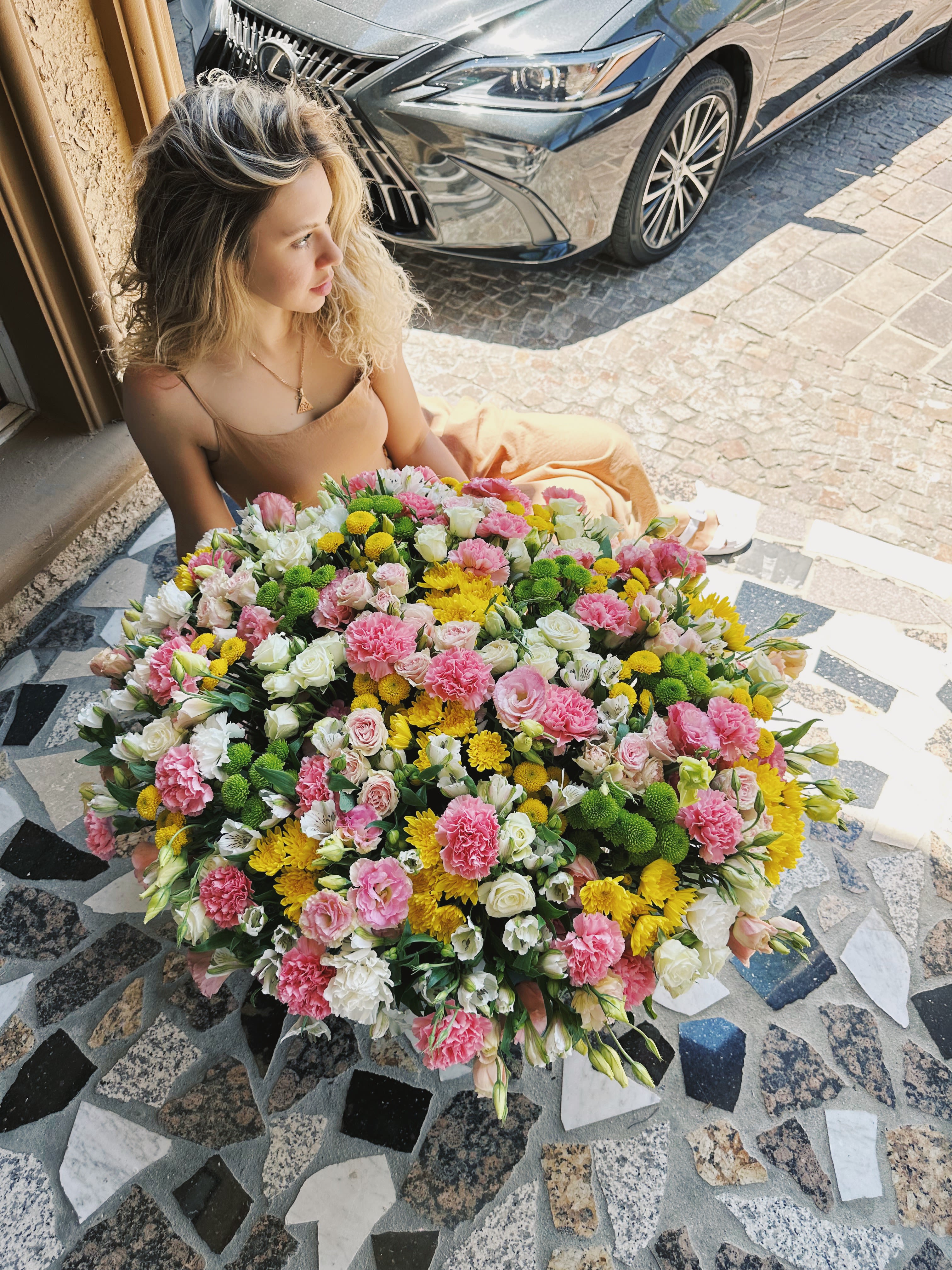 Large mixed bouquet of pink, white, and yellow flowers