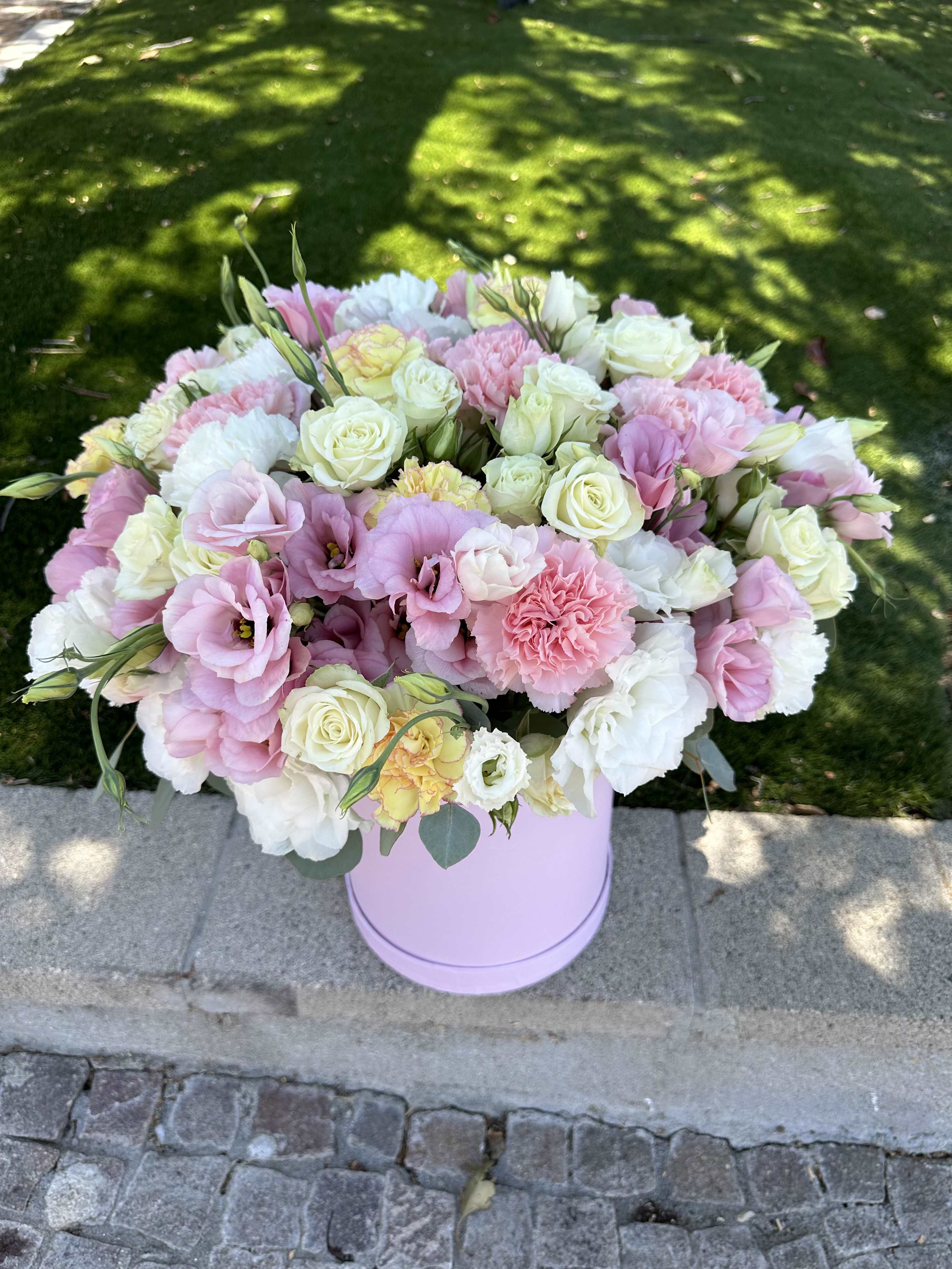 Pink and white mixed bouquet in a lavender hatbox