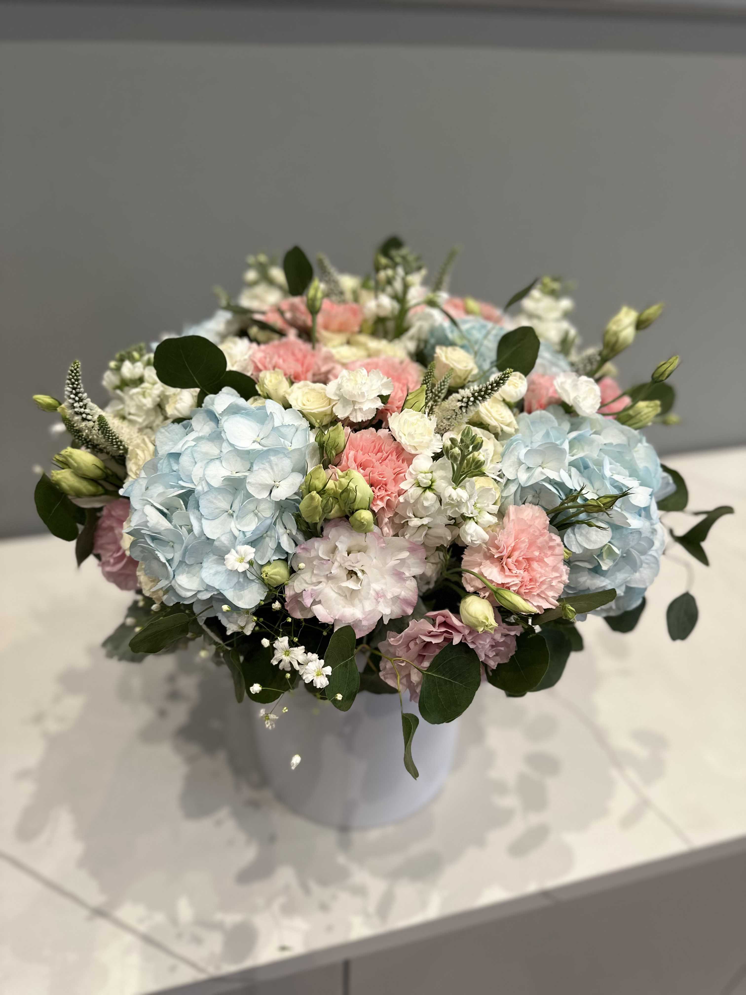 Waiting for a miracle - A delicate mix of flowers in soft blue and pink tones — the perfect décor for a heartwarming and joyful moment of expecting a baby. Voluminous hydrangeas, combined with complementary blooms, create an airy, light, and festive atmosphere.  This arrangement will be a stylish accent for a gender reveal celebration, adding even more emotion, beauty, and magic to the occasion.  