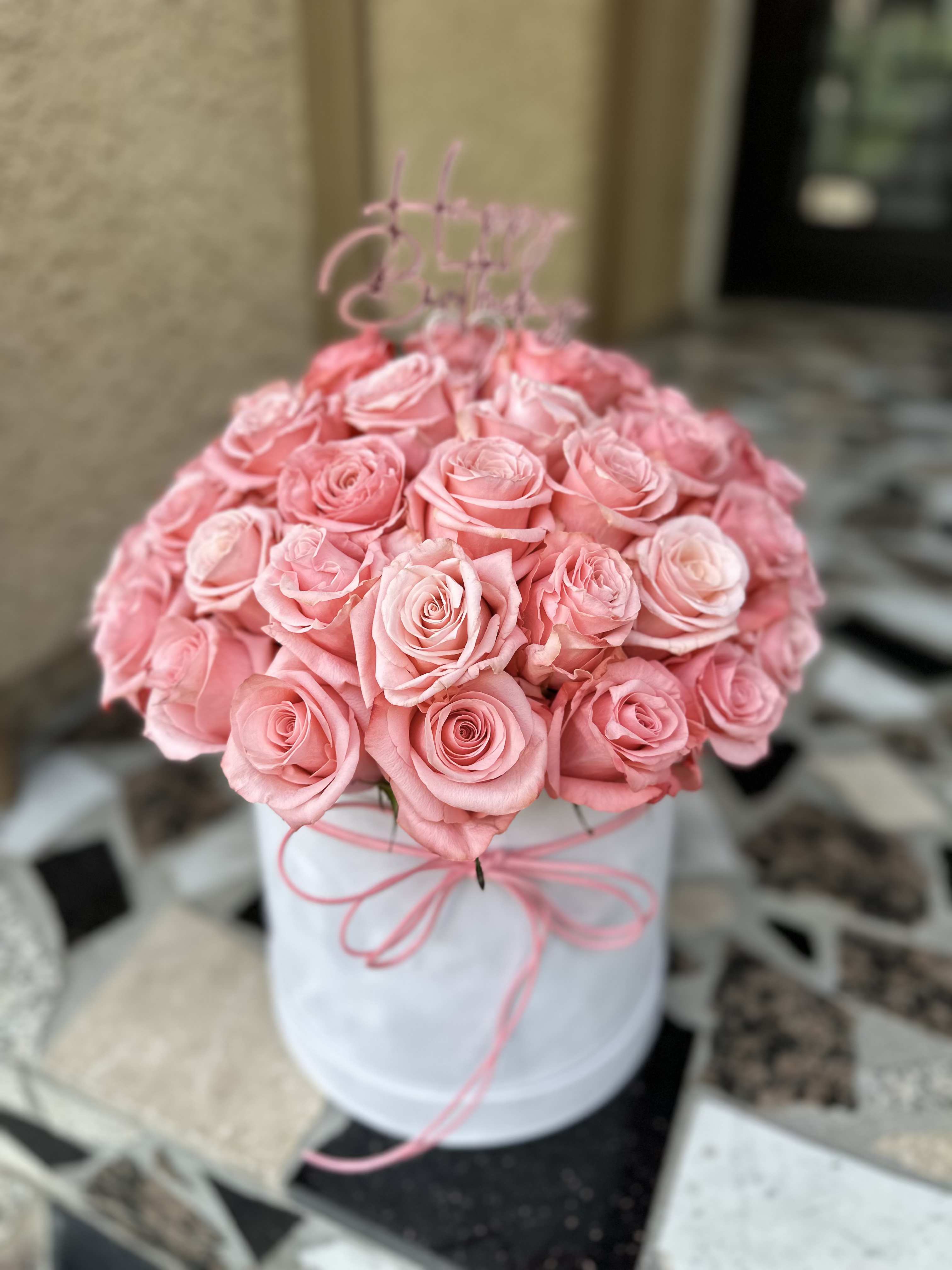 Warm Embrace - This arrangement is a heartfelt confession in bloom. Fifty vibrant pink roses — not just flowers, but the beating heart of love, passion, and tenderness. Each rose speaks of admiration, warmth, and the desire to be near.  A gift that needs no words. It softly whispers: “You are my inspiration.”