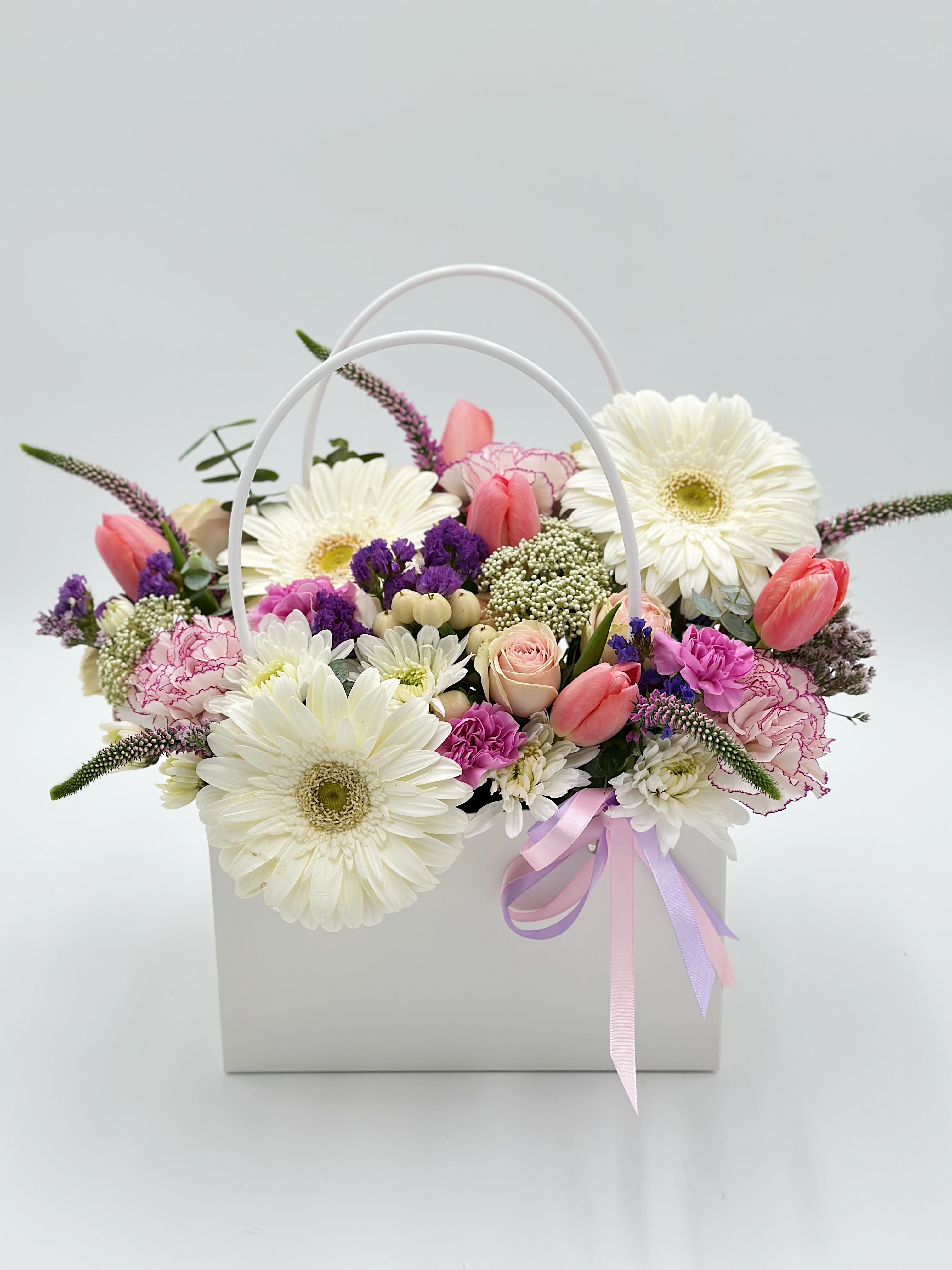 Mixed bouquet in a white handled box with pink and white flowers