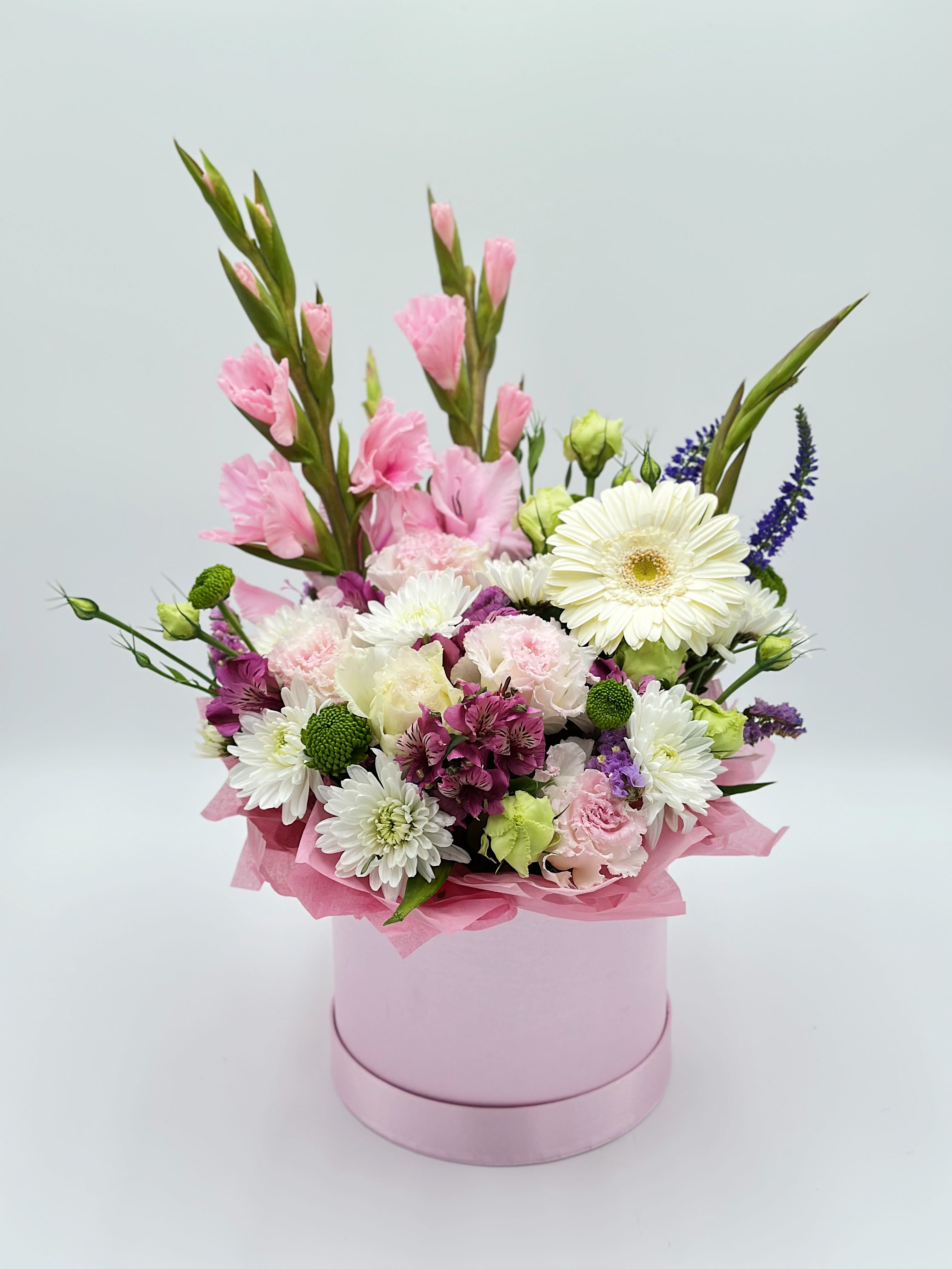 Pink and white mixed bouquet in a round pink box