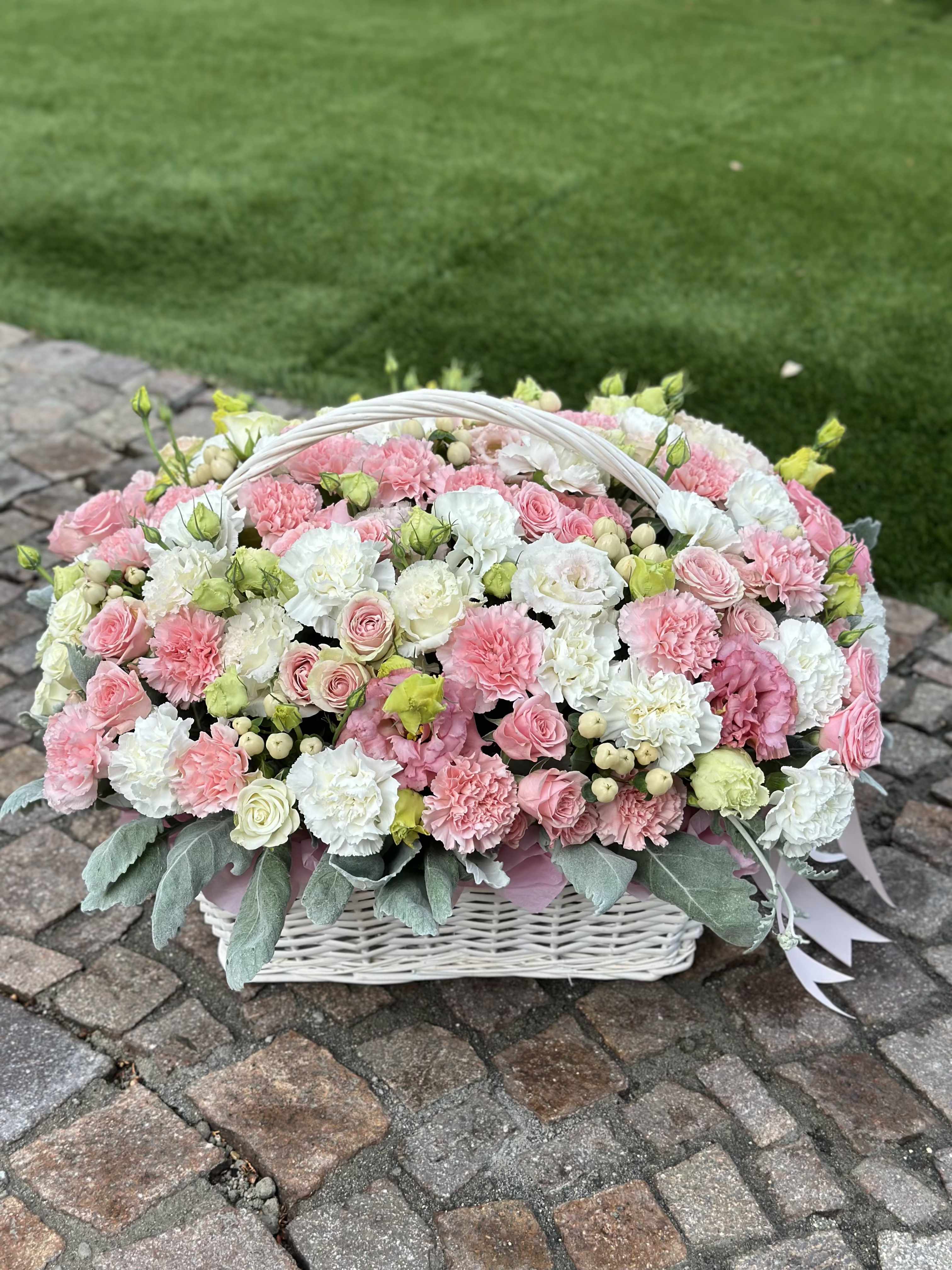Pink and white flower basket with a white handle